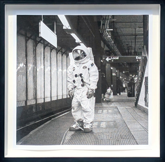 ANDY BLANK, "Space Underground" Contemporary Black and White Photograph of an Astronaut Riding a Bike